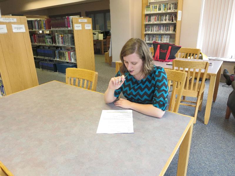 Student taking a test in the Library